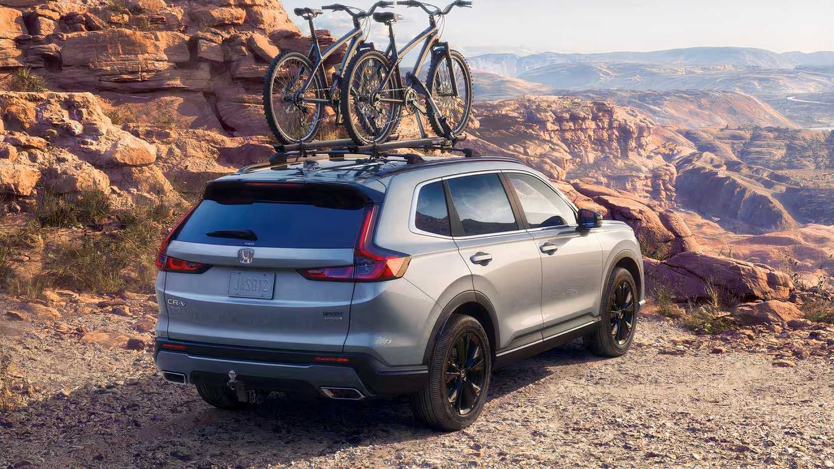 2026 Honda CR-V Sport Touring Hybrid rear 3/4 parked off-road