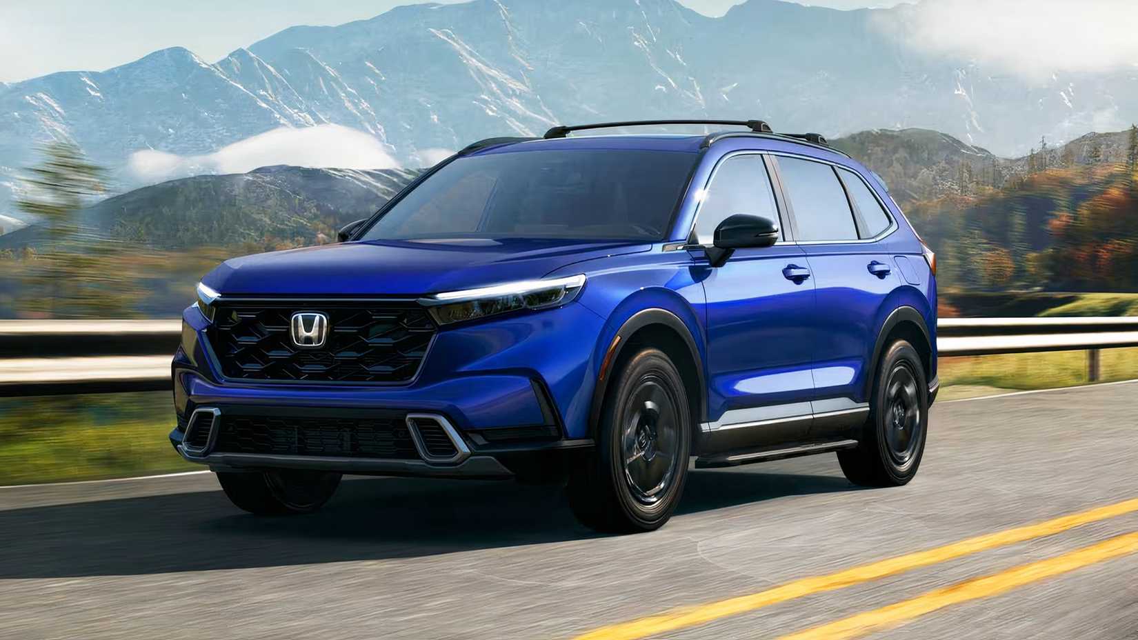 2026 Honda CR-V Sport Touring Hybrid dianteiro 3/4 dirigindo na rodovia