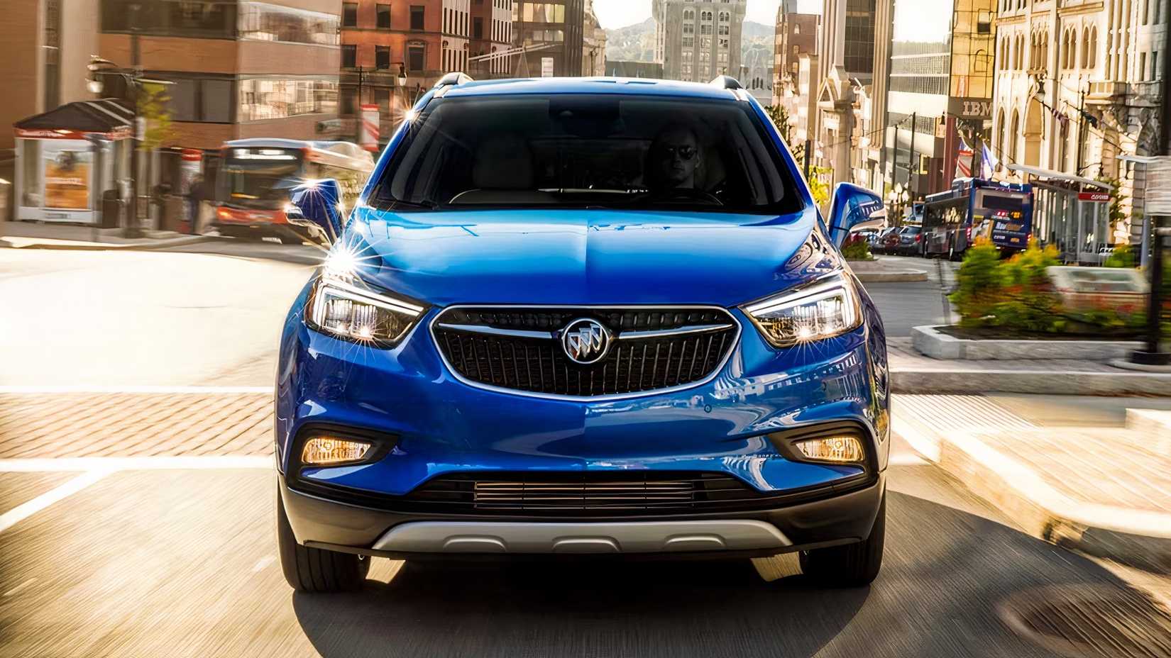 Front action shot of 2021 Buick Encore in blue driving