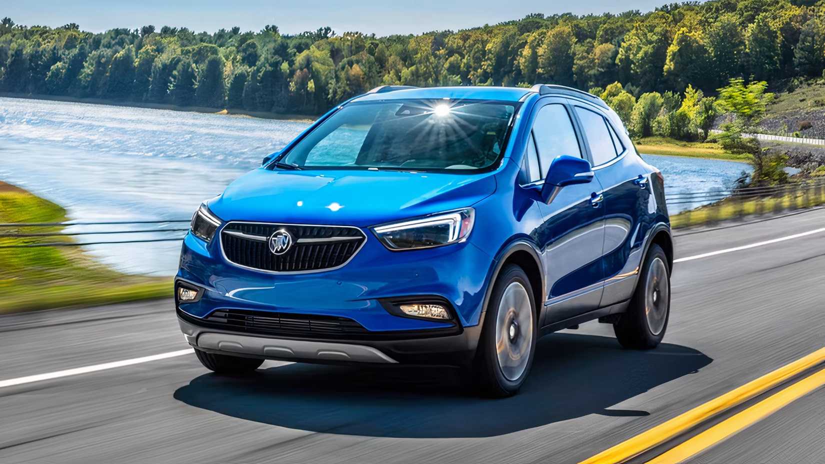 Front 3/4 action shot of 2021 Buick Encore in blue driving on road