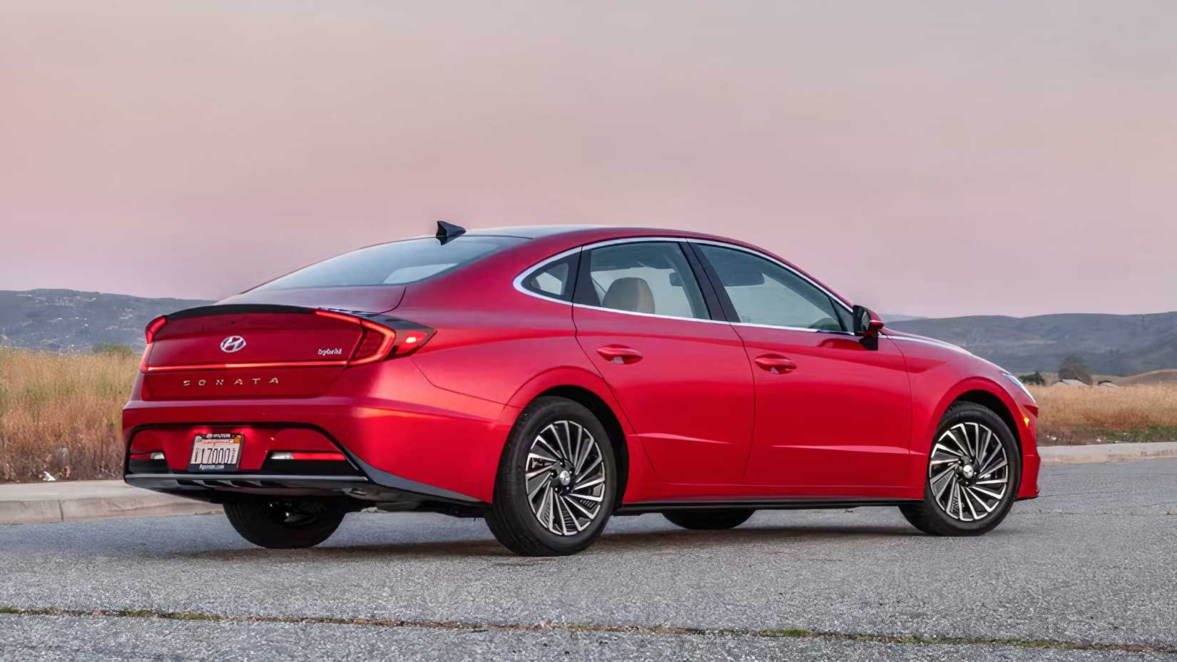 2020 Hyundai Sonata Hybrid in red rear 3/4