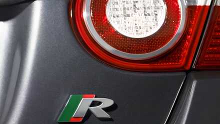 Pre-facelift Jaguar XKR displays its R badge in a close-up shot