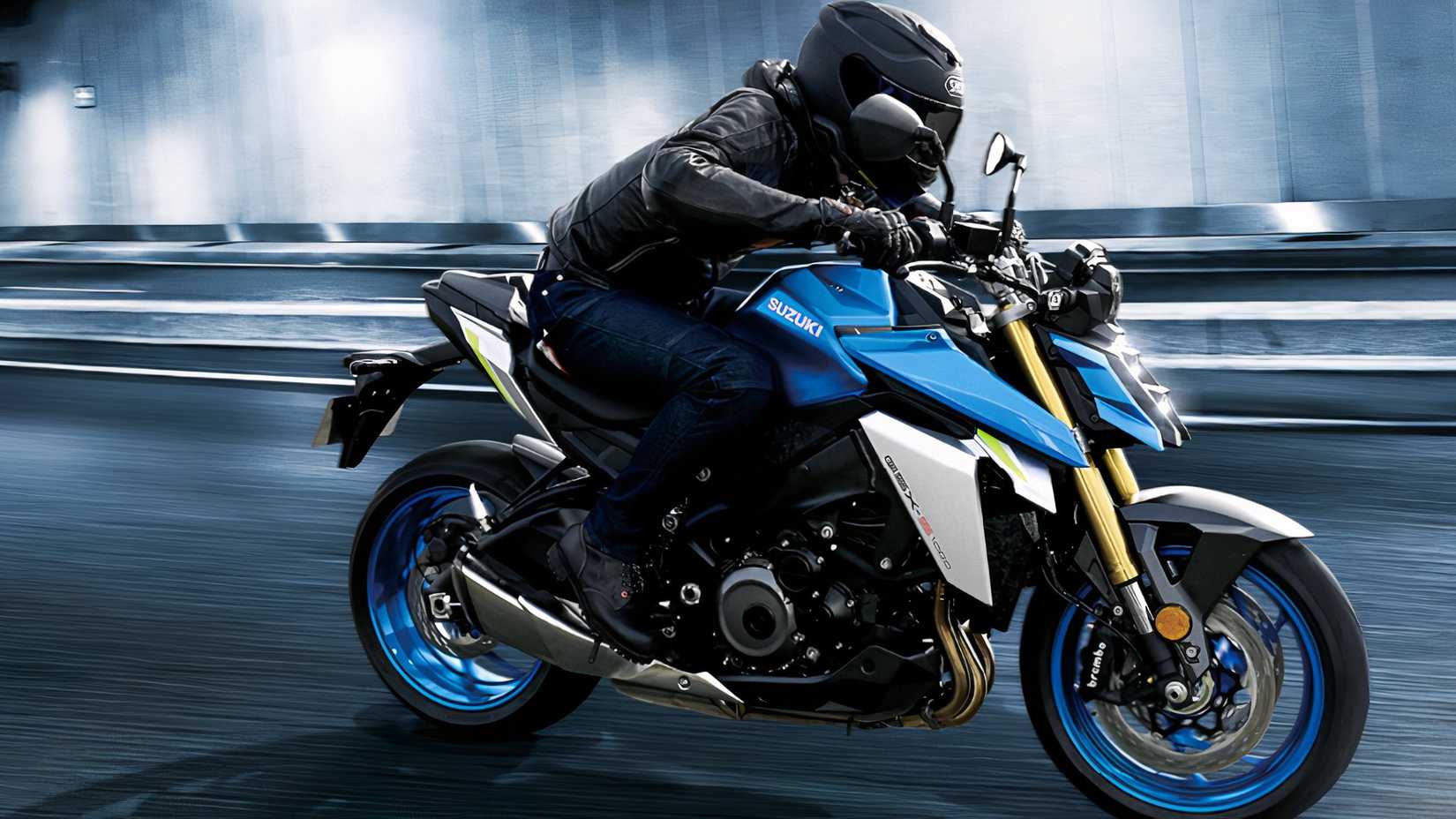 Foto de ação de uma Suzuki GSX-S1000 andando por um túnel