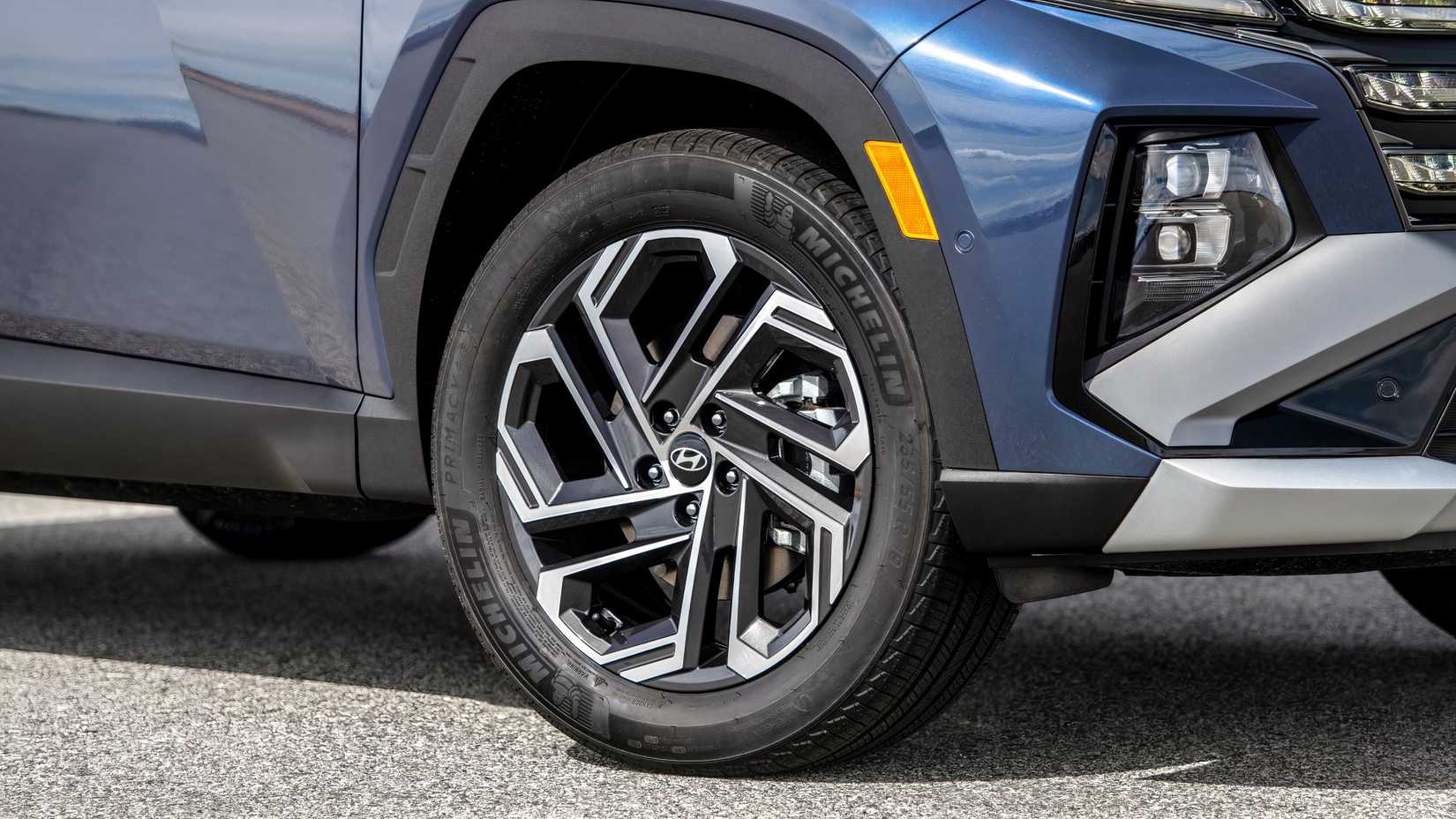 2026 Hyundai Tucson Hybrid Hyundai SUV front wheel and tire close-up.