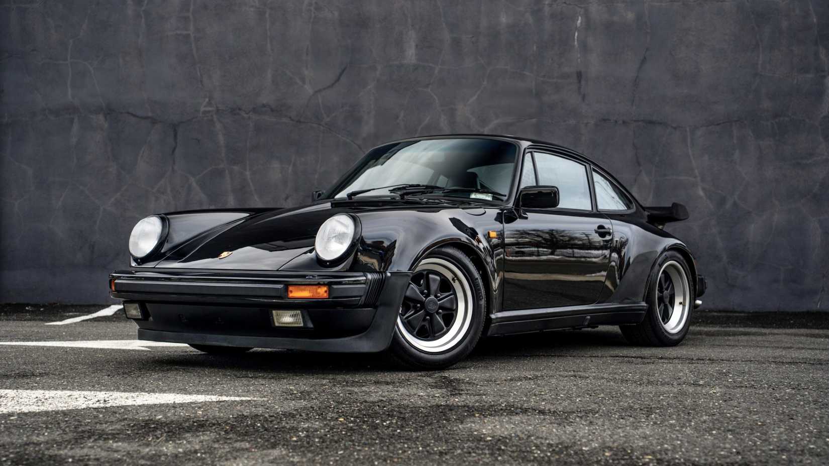 Front three-quarters shot of a black 1989 Porsche 911 Turbo