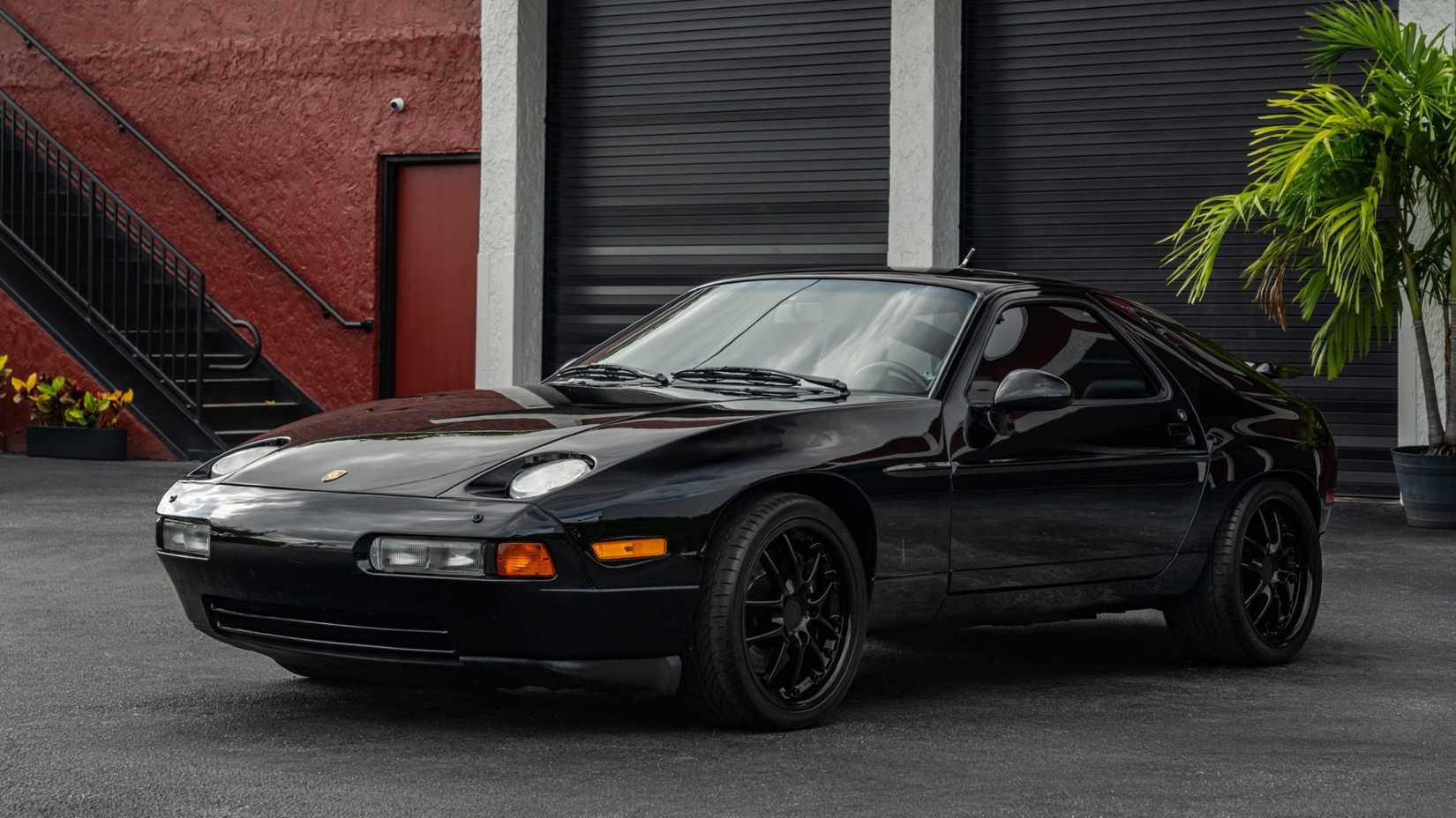 Front three-quarters shot of a black 1993 Porsche 928 GTS