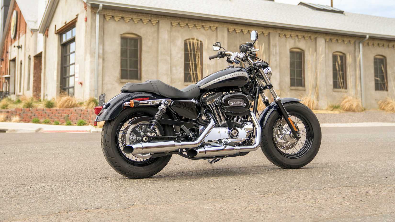 2019 Harley-Davidson Sportster 1200 Custom parked on a street corner, static profile shot