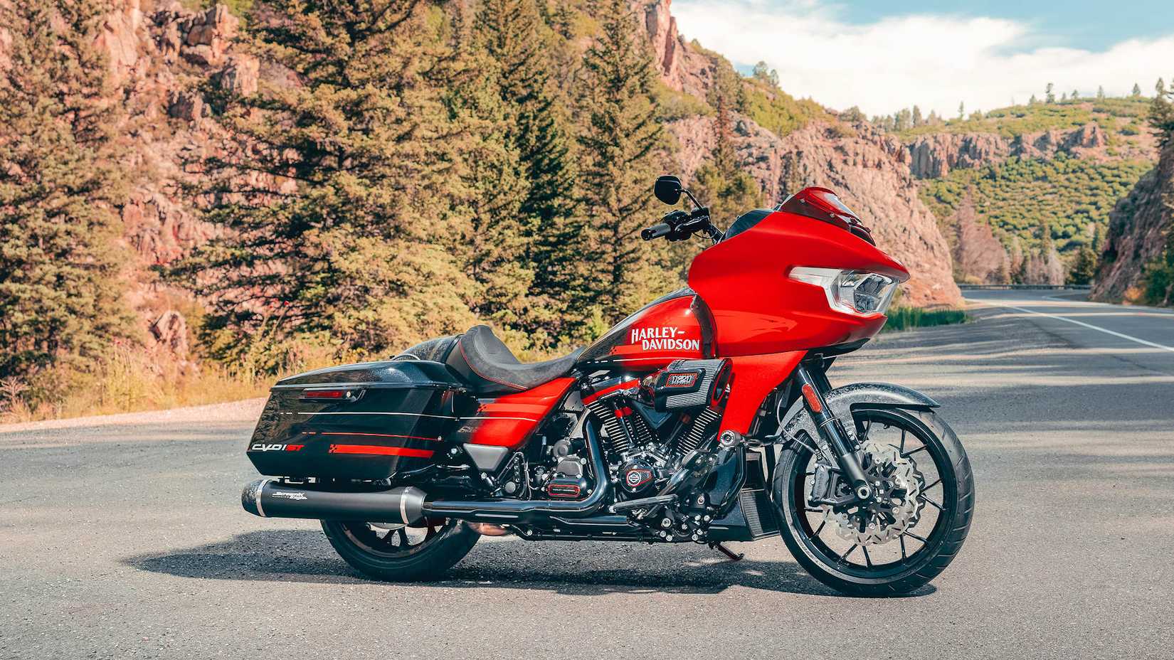 Side shot of a red 2026 Harley-Davidson CVO Road Glide ST parked curbside