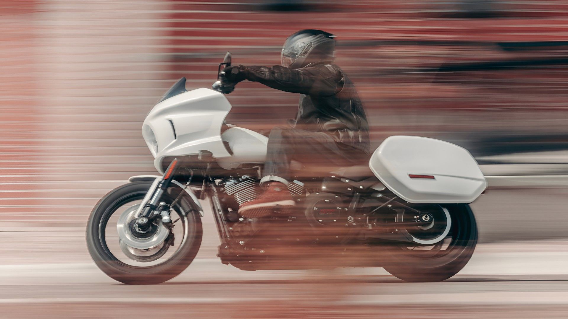 2026 Harley-Davidson Low Rider ST accelerating hard side profile view
