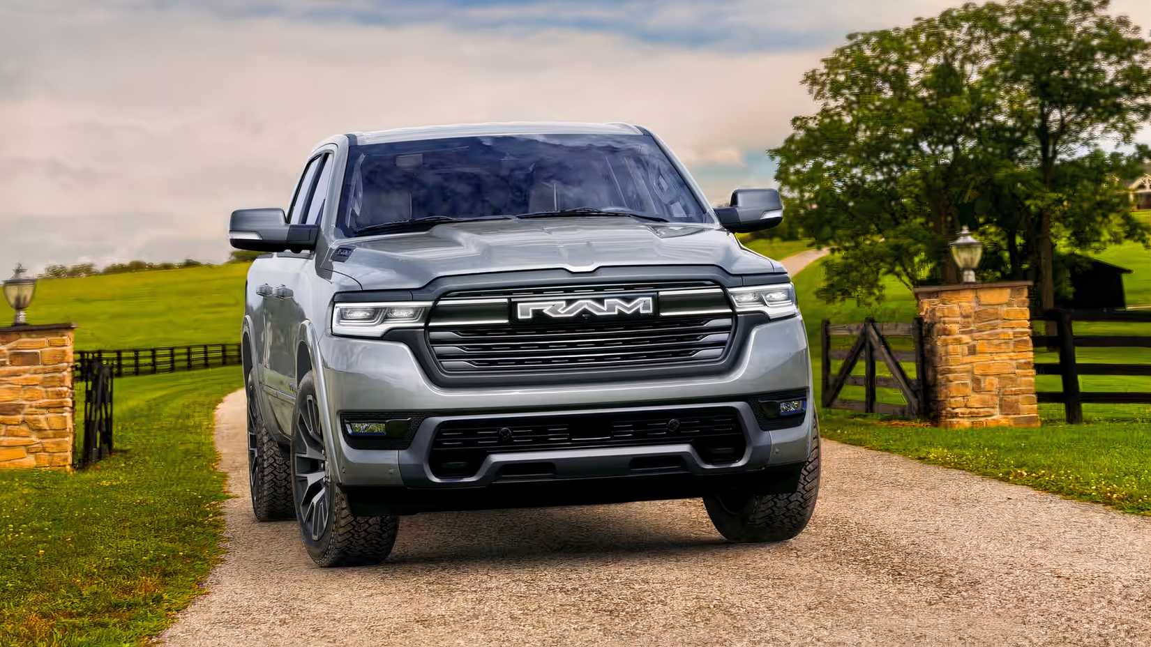 Uma vista frontal de um 2027 RAM REV passando por um portão