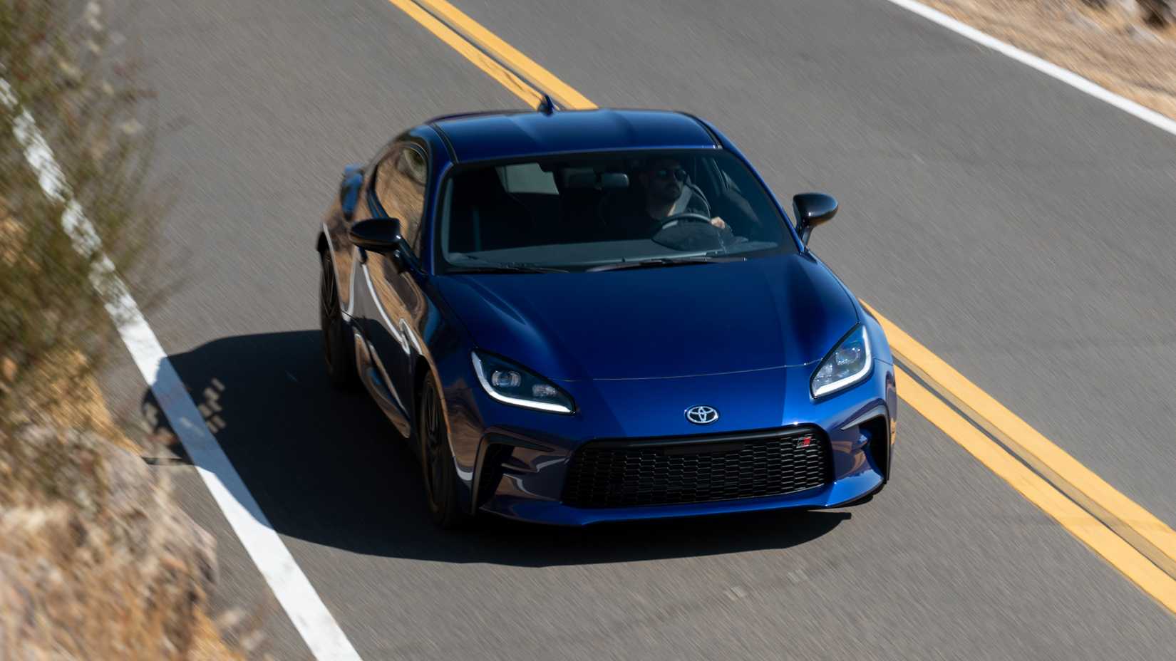 Blue 2027 Toyota GR86 in motion