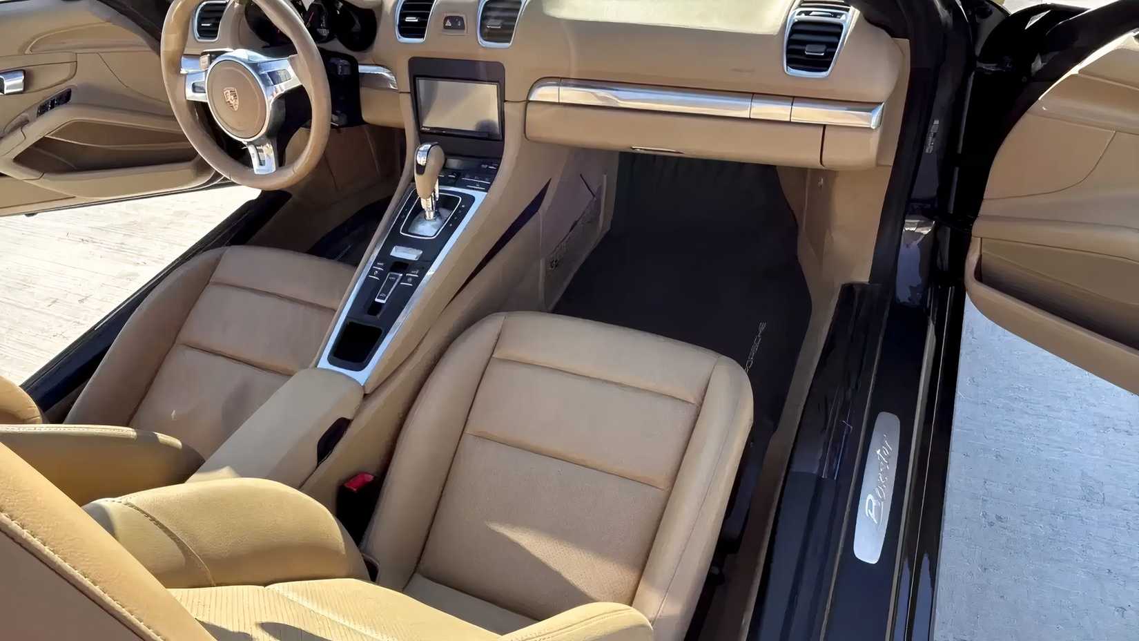 2015 Porsche Boxster interior shot showing front seats and cabin
