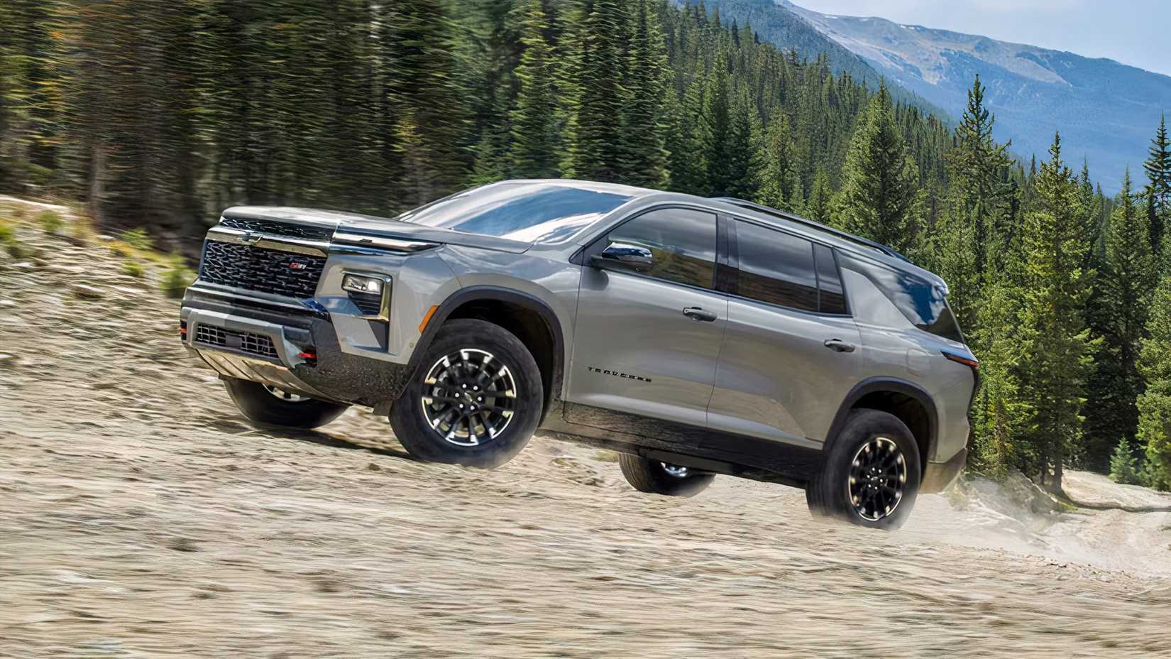 Front 3/4 action shot of 2026 Chevrolet Traverse driving off-road