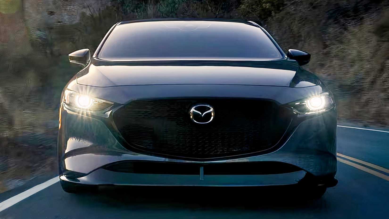 Close-up action shot of 2026 Mazda 3 front end
