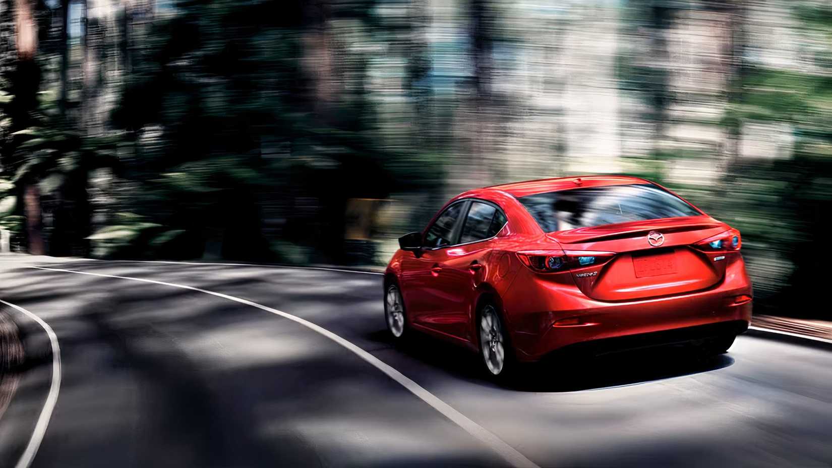 2017 Mazda 3 Sedan in red rear 3/4