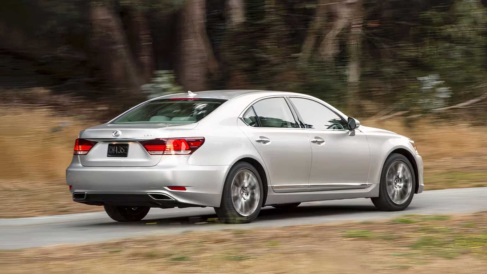 Rear 3/4 shot of 2017 Lexus LS 460 driving on road