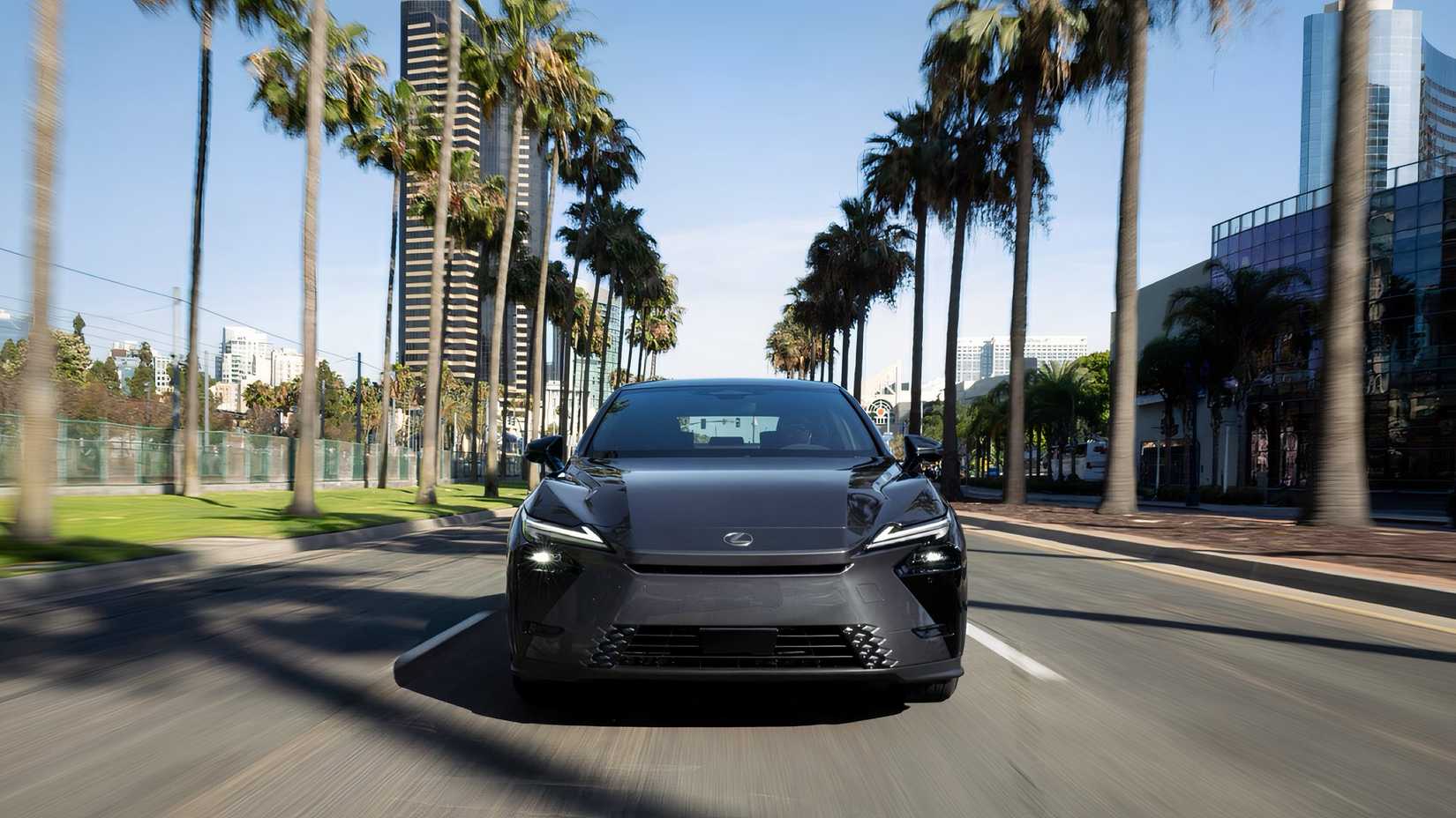Front action shot of 2026 Lexus ES 350h driving on road