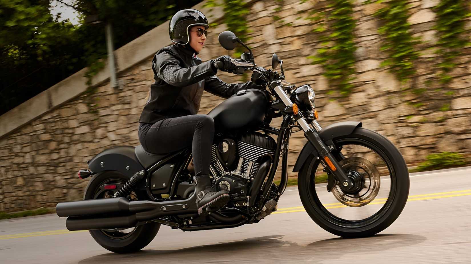 2026 Indian Chief moving fast on city road, side profile view