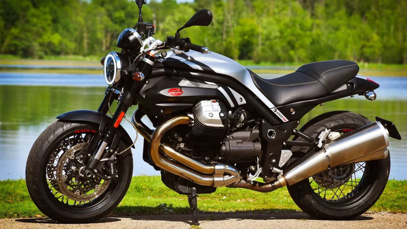A static shot of the Moto Guzzi Griso 1200 8v SE parked next to a lake