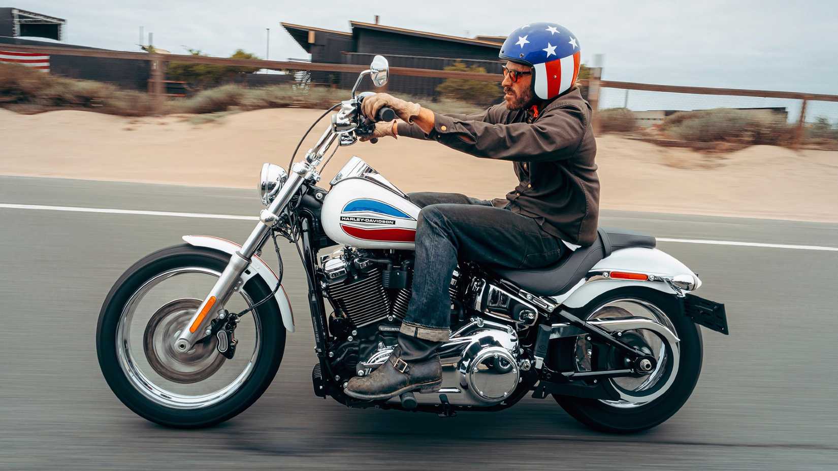 Panning Shot Of 2026 Harley-Davidson Super Glide Riding On The Road