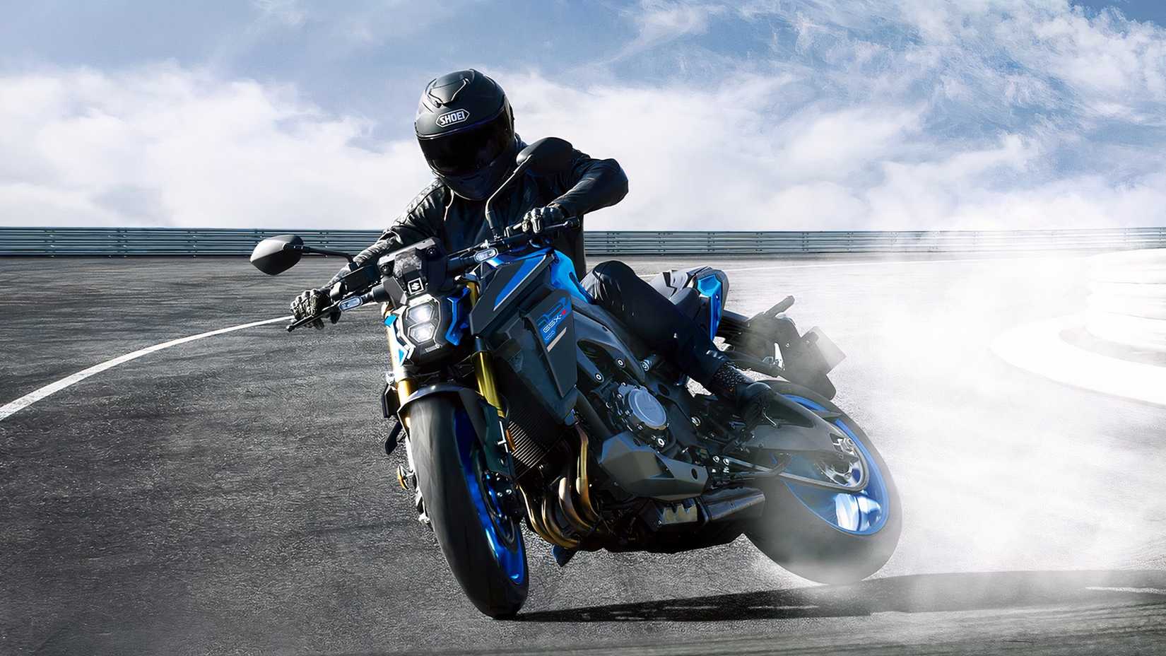 Rider sliding the Suzuki GSX-S1000 sideways