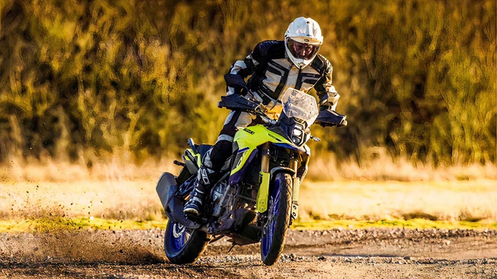 Action shot of a Suzuki V-Strom 800DE being ridden in the dirt