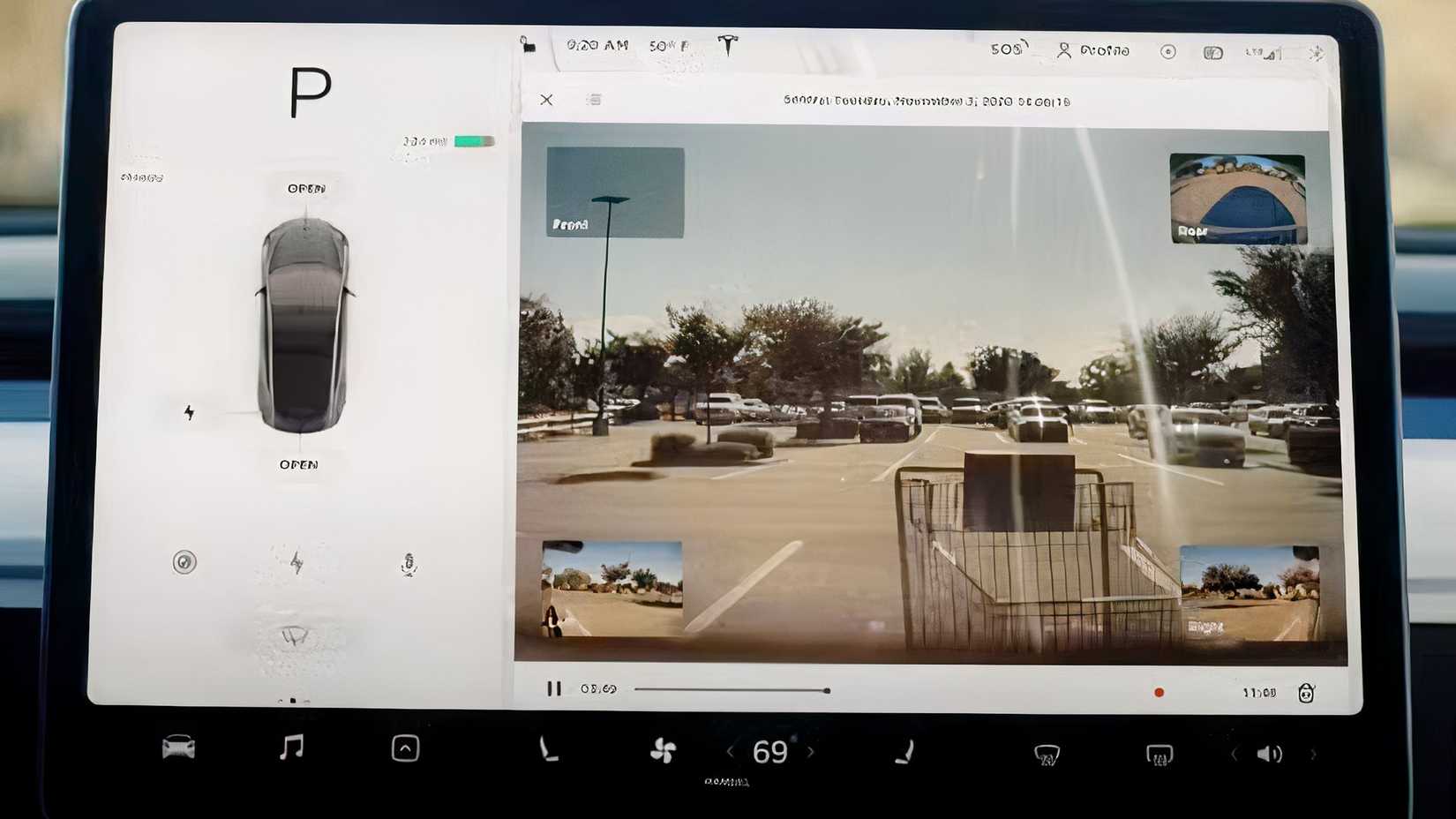Captura detalhada do interior de um Tesla mostrando a tela central na transmissão ao vivo do Modo Sentinela