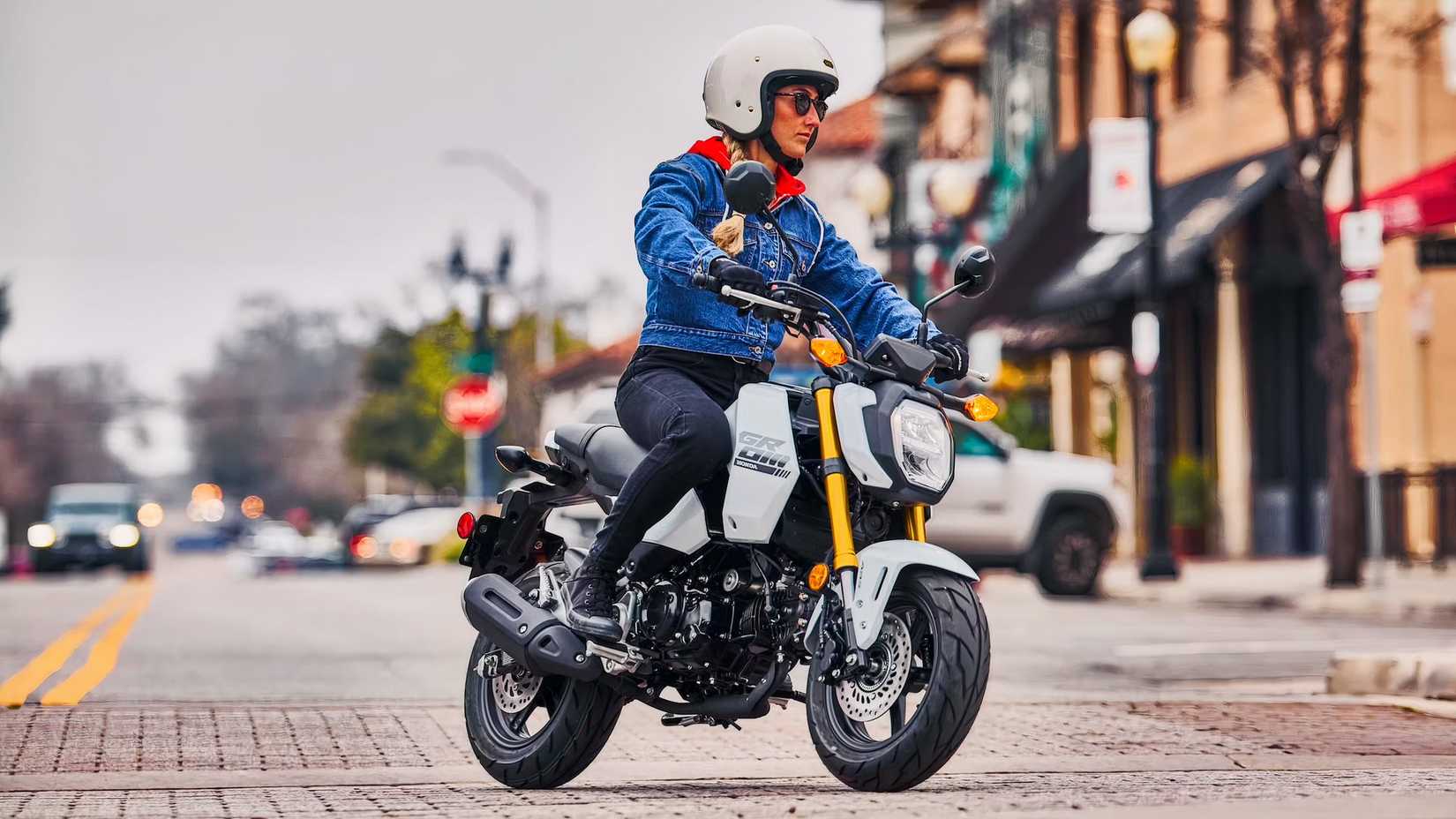 2025 Honda Grom being ridden on the street