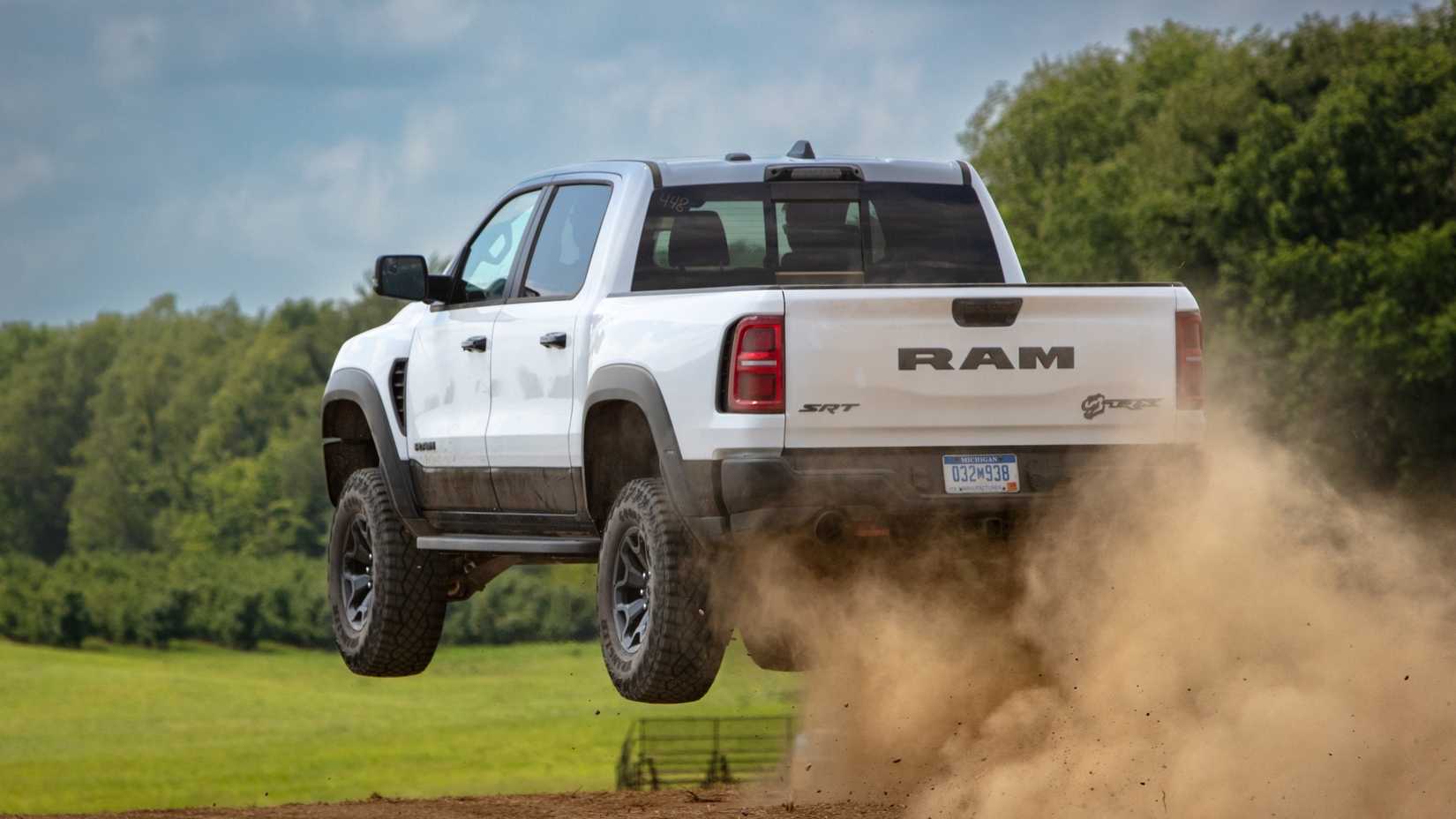 Rear 3/4 action shot of 2027 Ram 1500 TRX jumping off-road