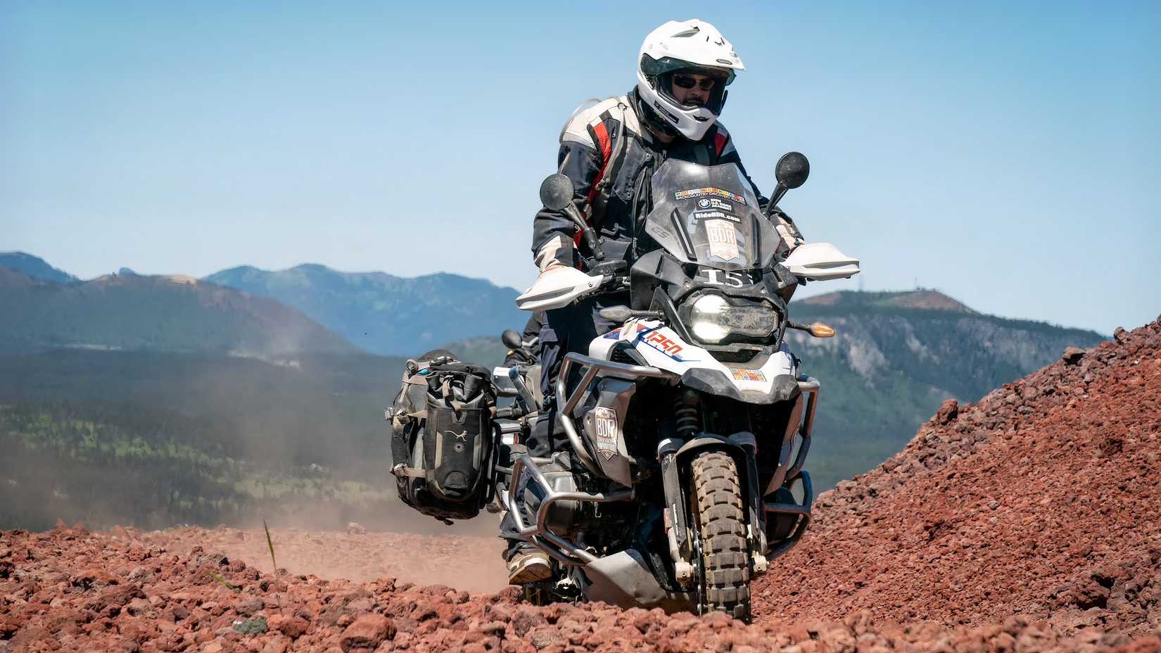 White BMW R 1250 GS Adventure riding in dirt terrain