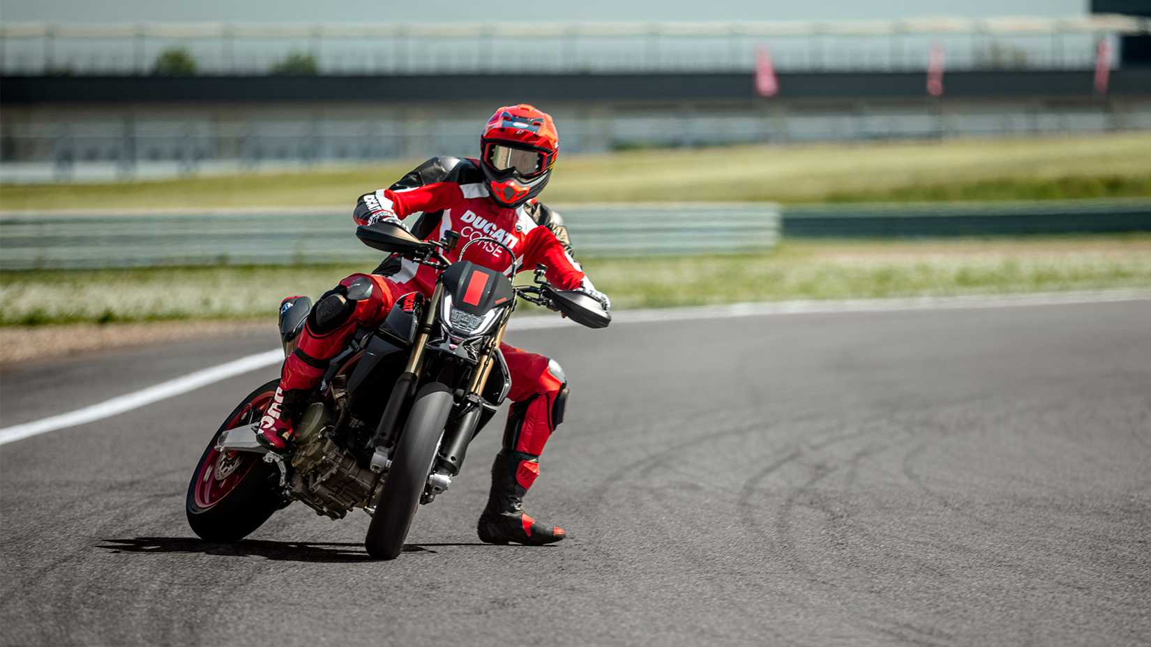 Action shot of the Ducati Hypermotard 698 sliding around a corner