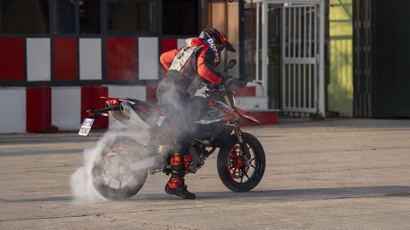 An action shot of the Ducati Hypermotard 698 doing a burnout