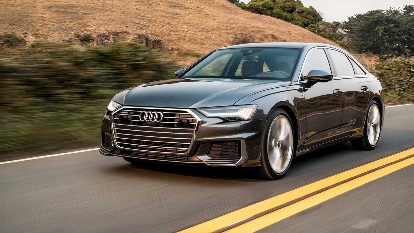 Front 3/4 action shot of 2026 Audi A6 driving on road