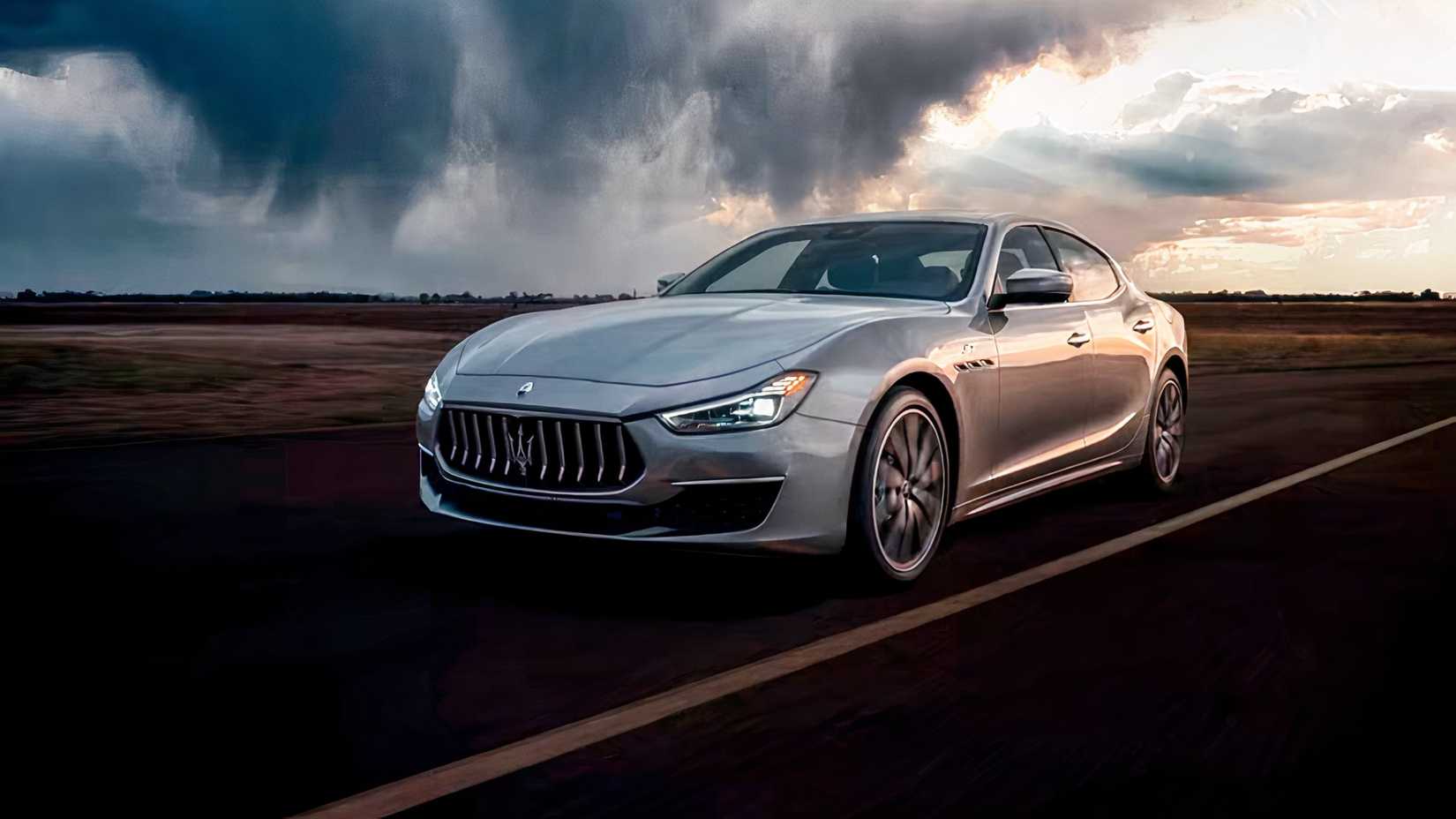 Front 3/4 action shot of 2021 Maserati Ghibli driving on road