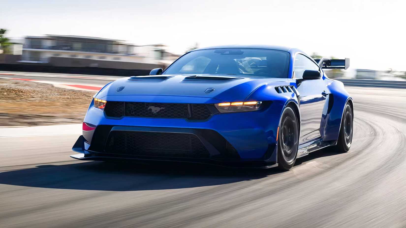 Front 3/4 action shot of 2026 Ford Mustang GTD driving on road