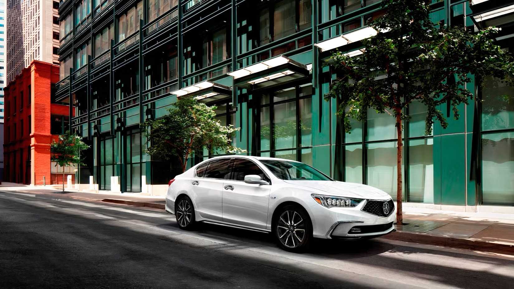 Front 3/4 action shot of 2020 Acura RLX driving on road