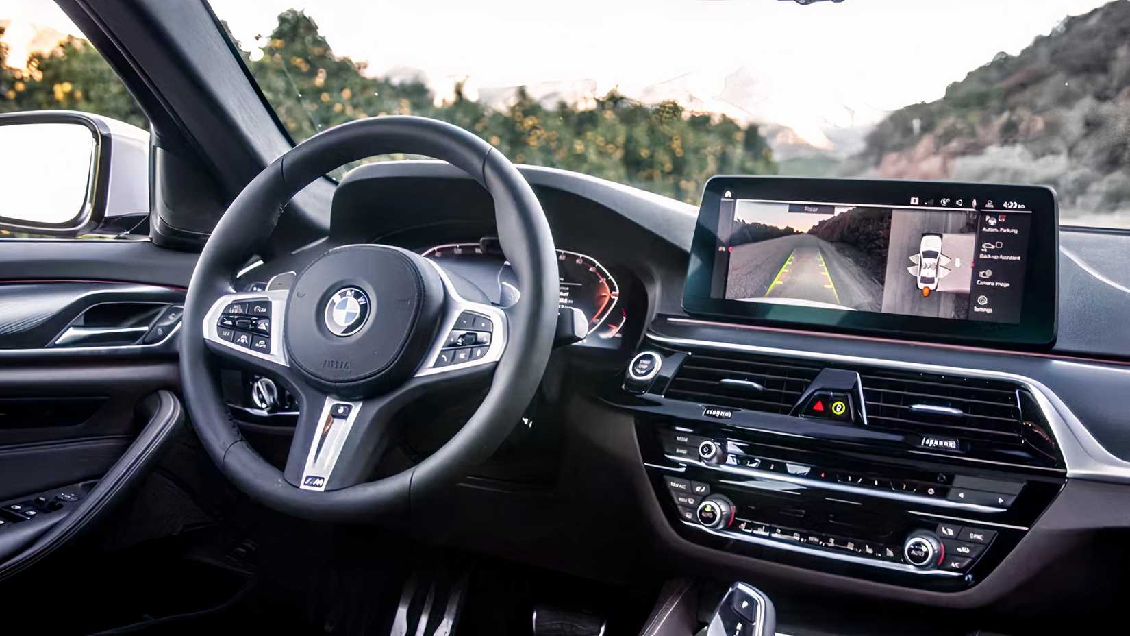 2021 BMW 5 Series sedan interior showing cockpit