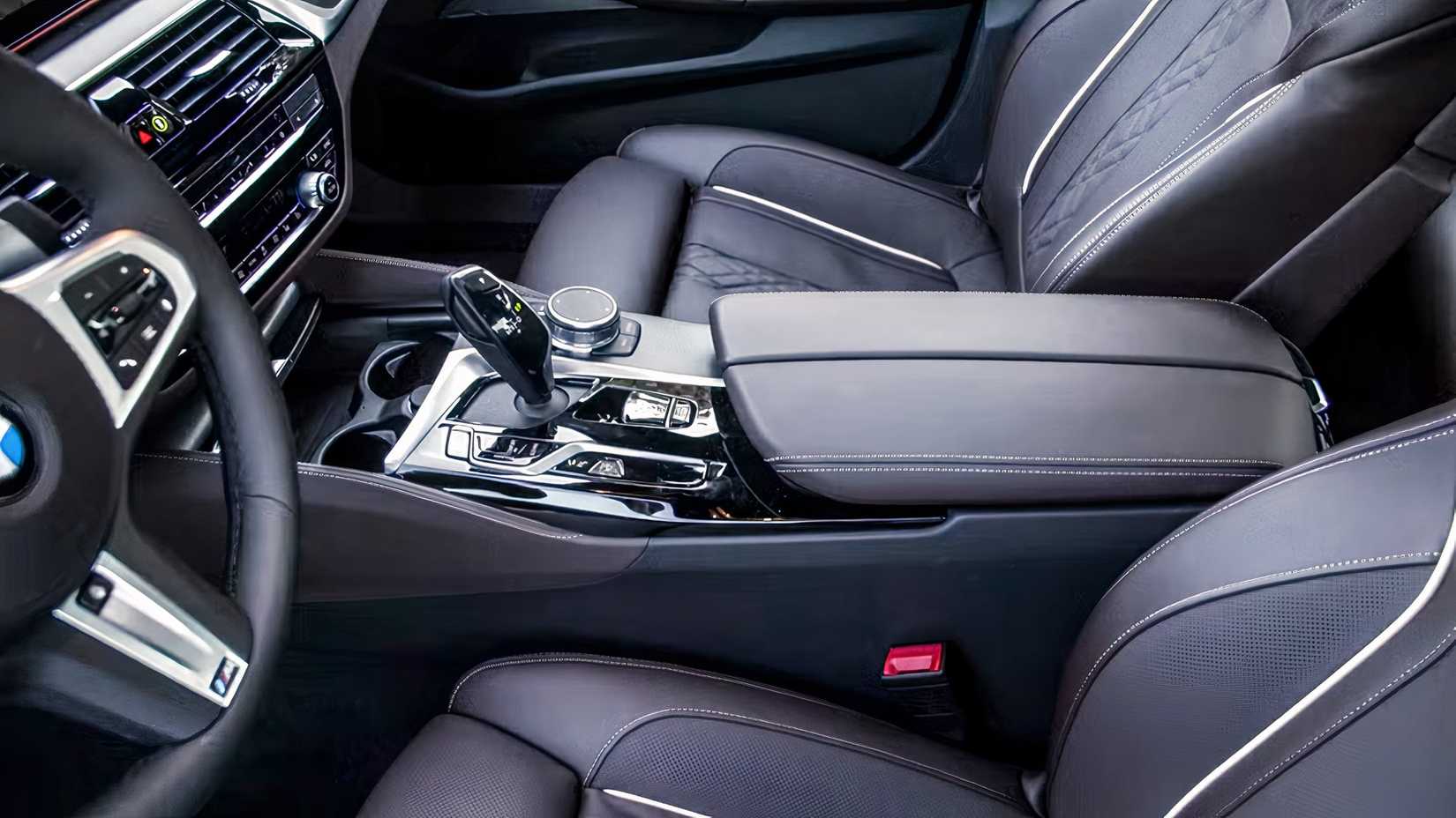 2021 BMW 5 Series sedan center console and storage cubby
