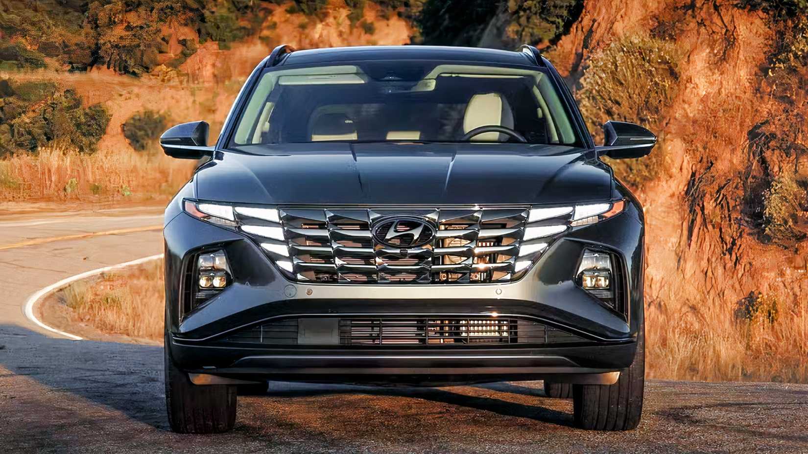 Front shot of 2023 Hyundai Tucson Hybrid parked on road