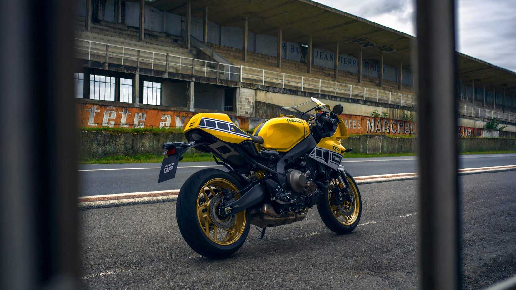Yamaha XSR900 GP - parked at the side of a vintage racing circuit
