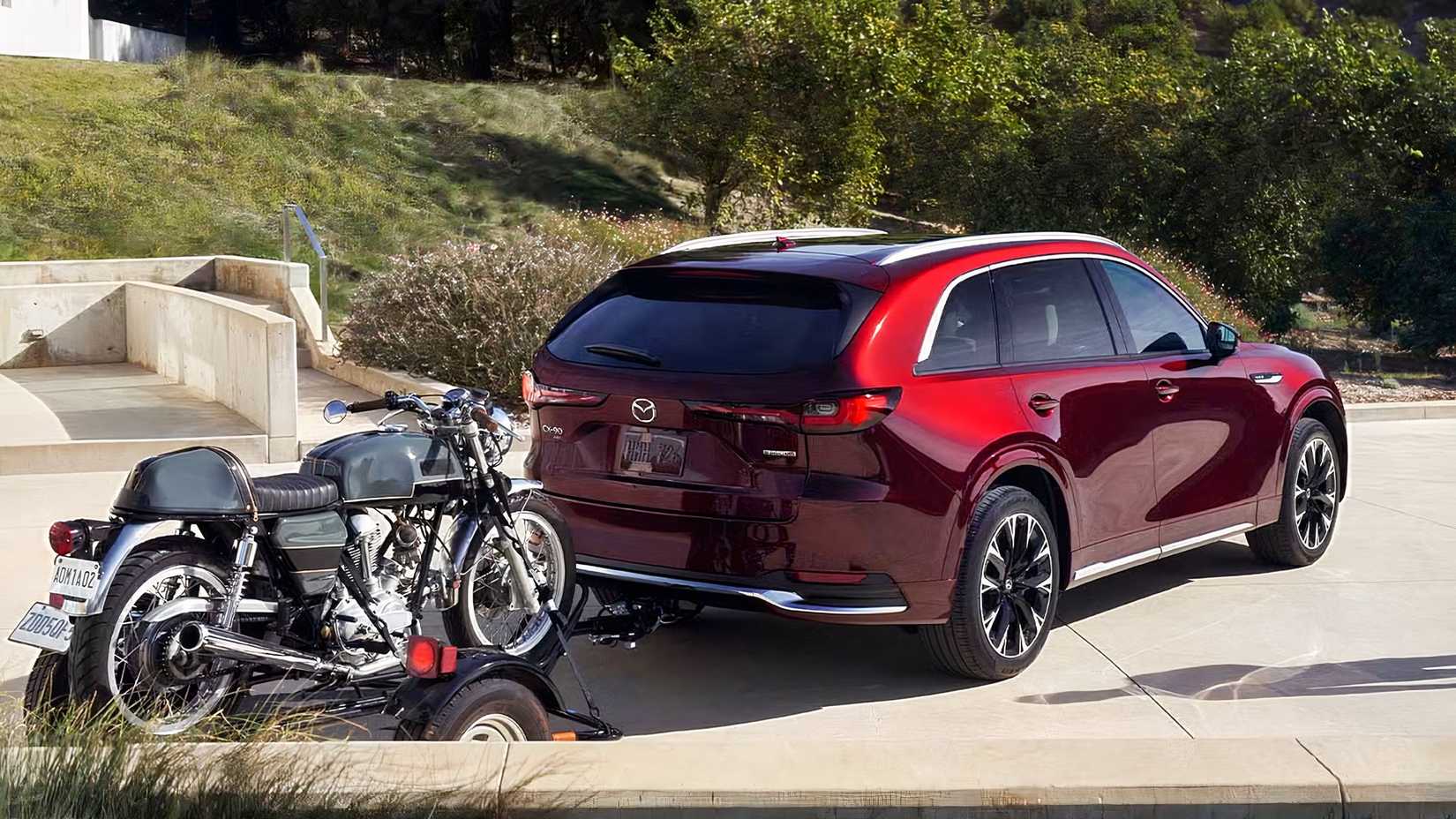 Rear 3/4 shot of 2026 Mazda CX-90 Towing A Motorcycle