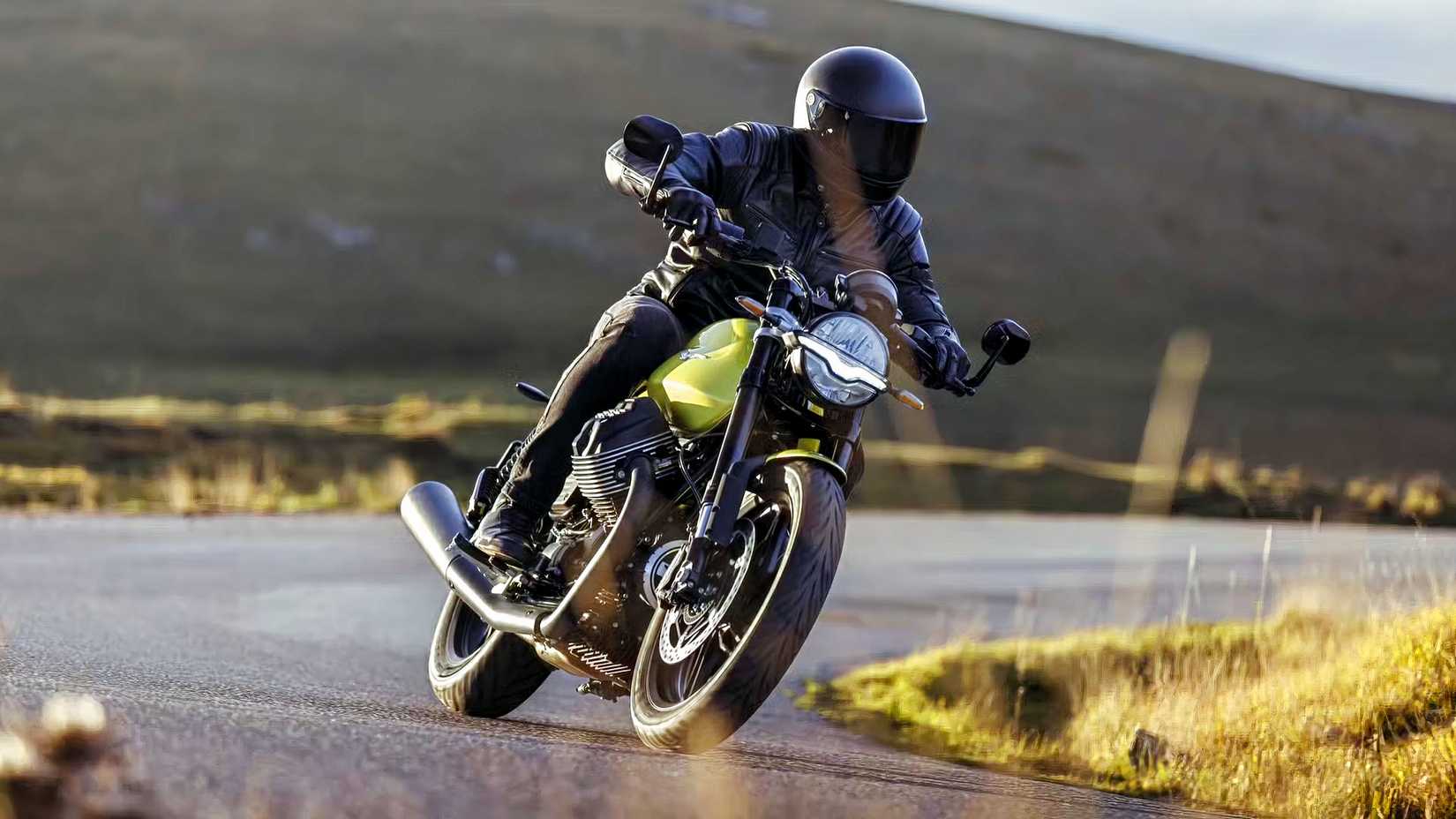 Rider on a 2025 Moto Guzzi V7 Sport coming out of a curve