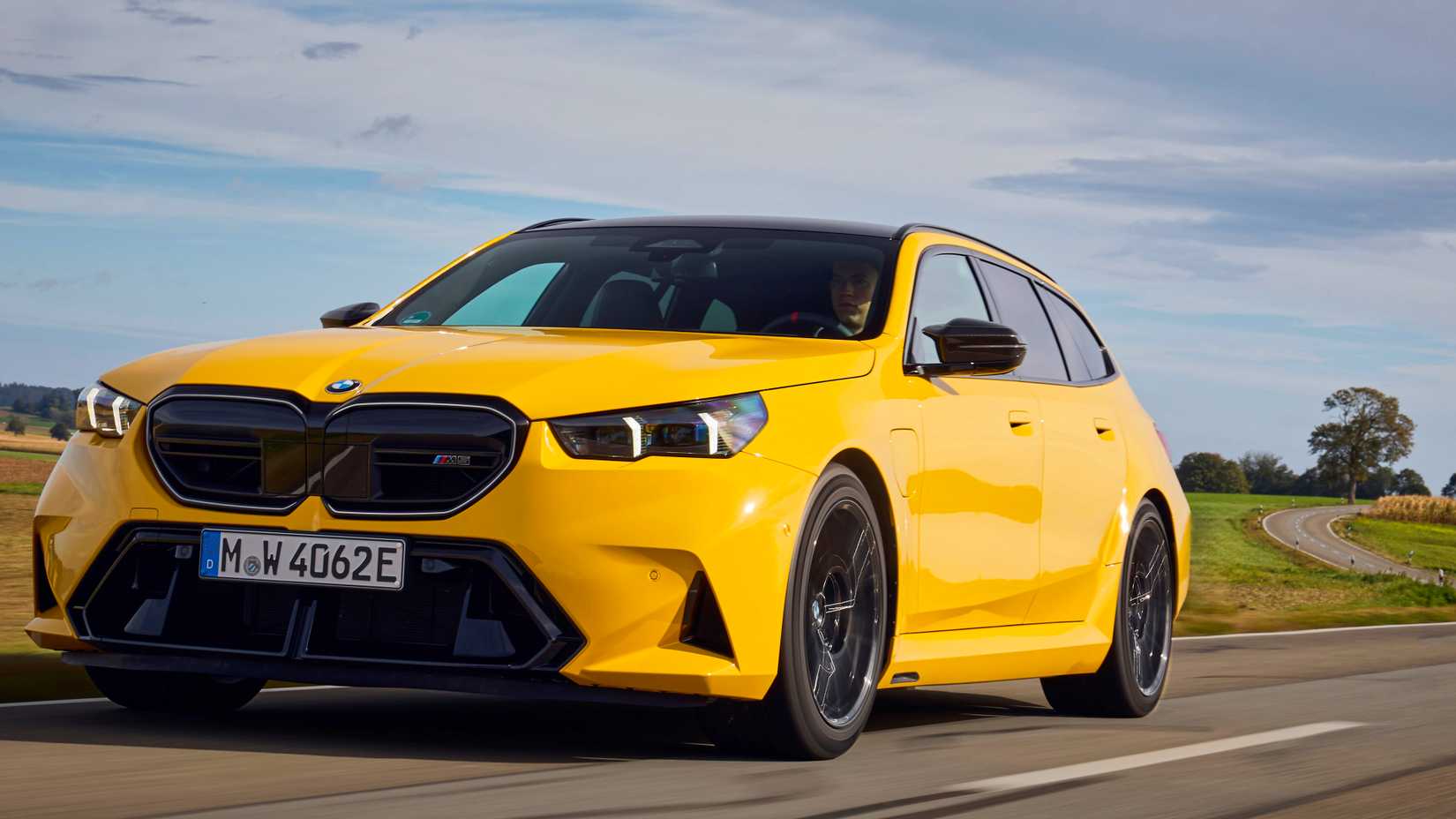 2026 BMW M5 Touring front 3/4 shot driving