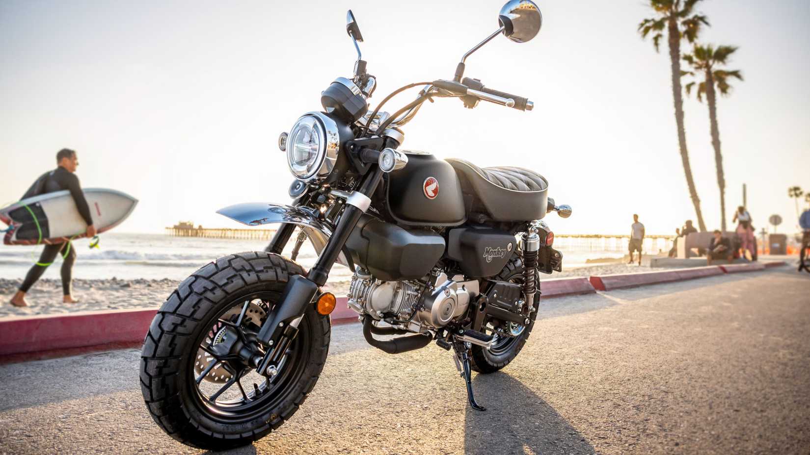 Honda Monkey parked by a boardwalk