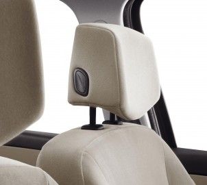 Energy-absorbing headrests for rear impacts