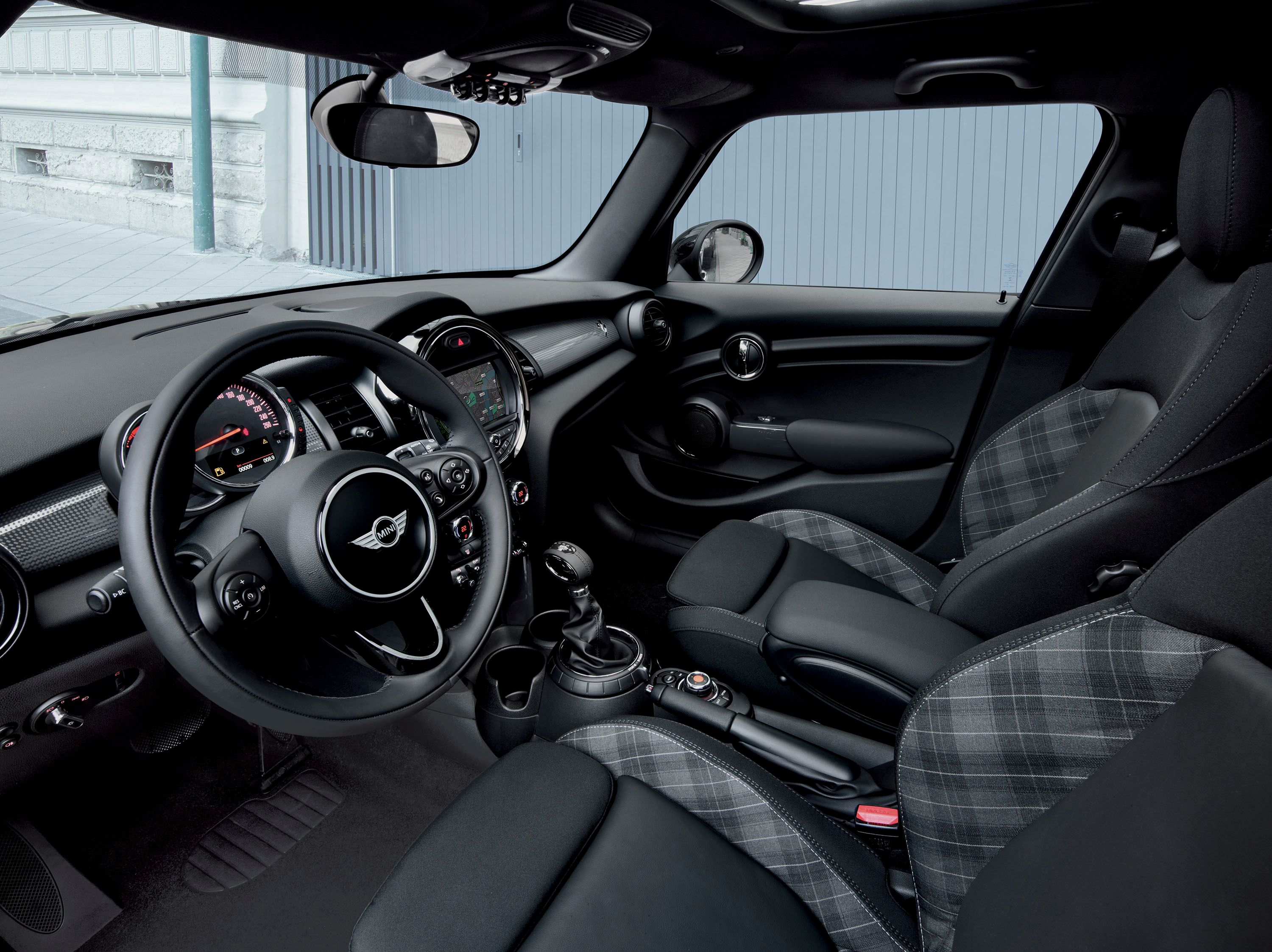  The interior is all black, with leather and fabric upholstery