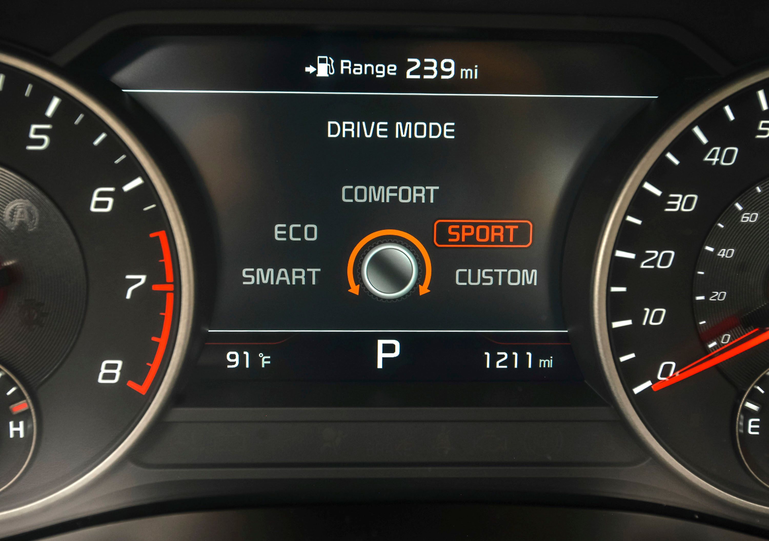 Instrument cluster includes oil temp, navigation, g-forces, and a lap timer