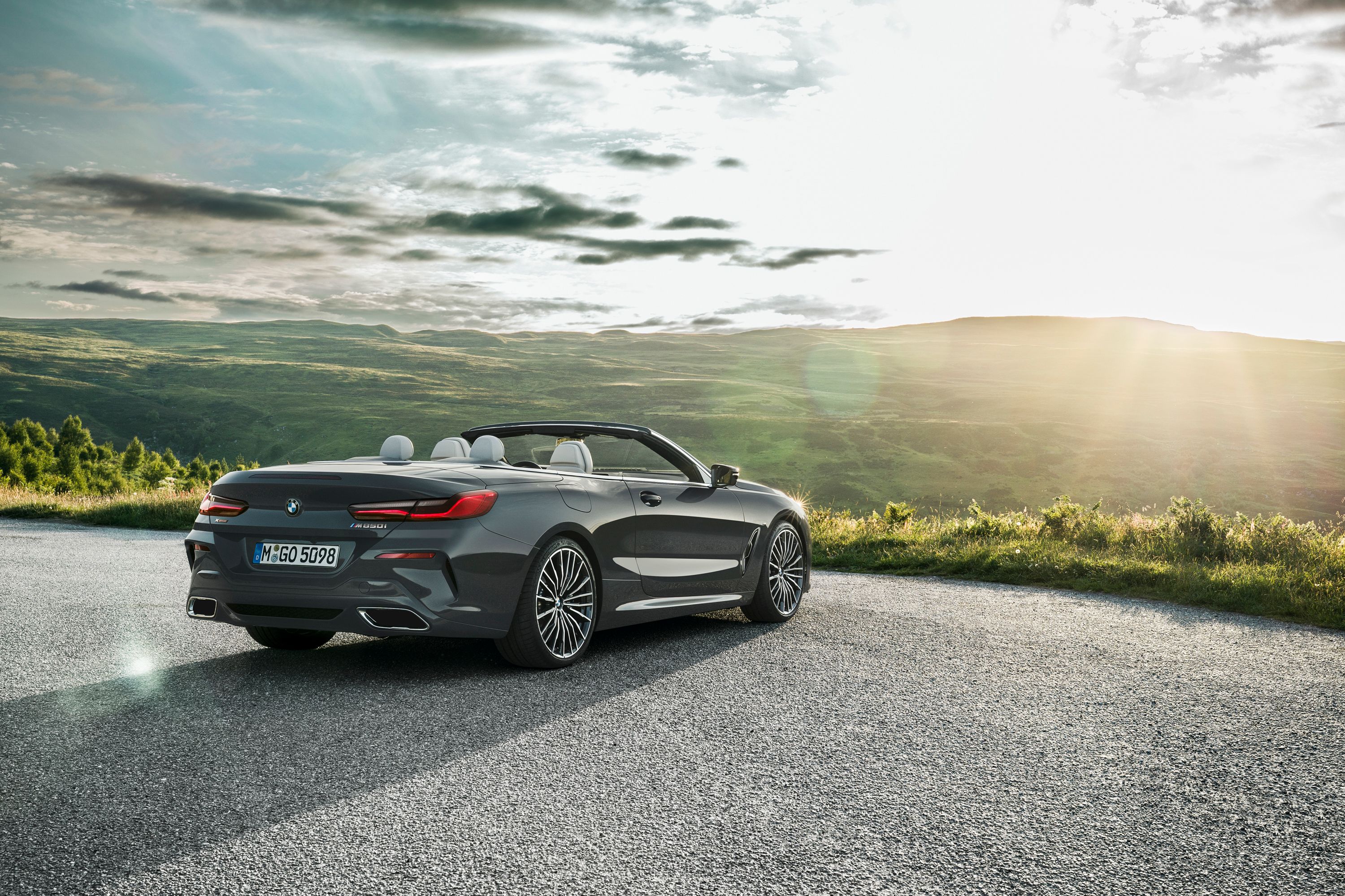 BMW 8 Series convertible on landscape