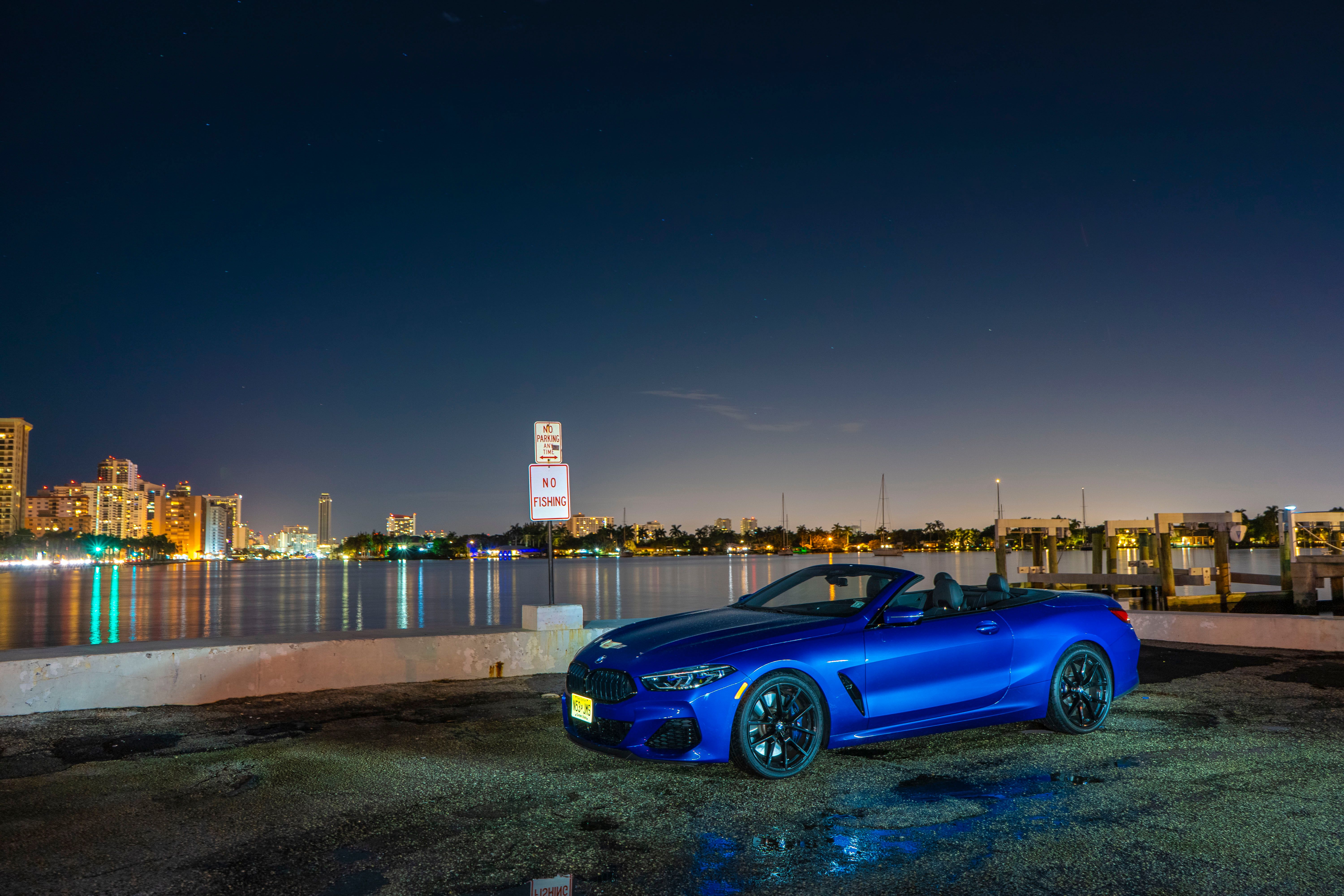 blue 2020 BMW M850i Convertible near the sea