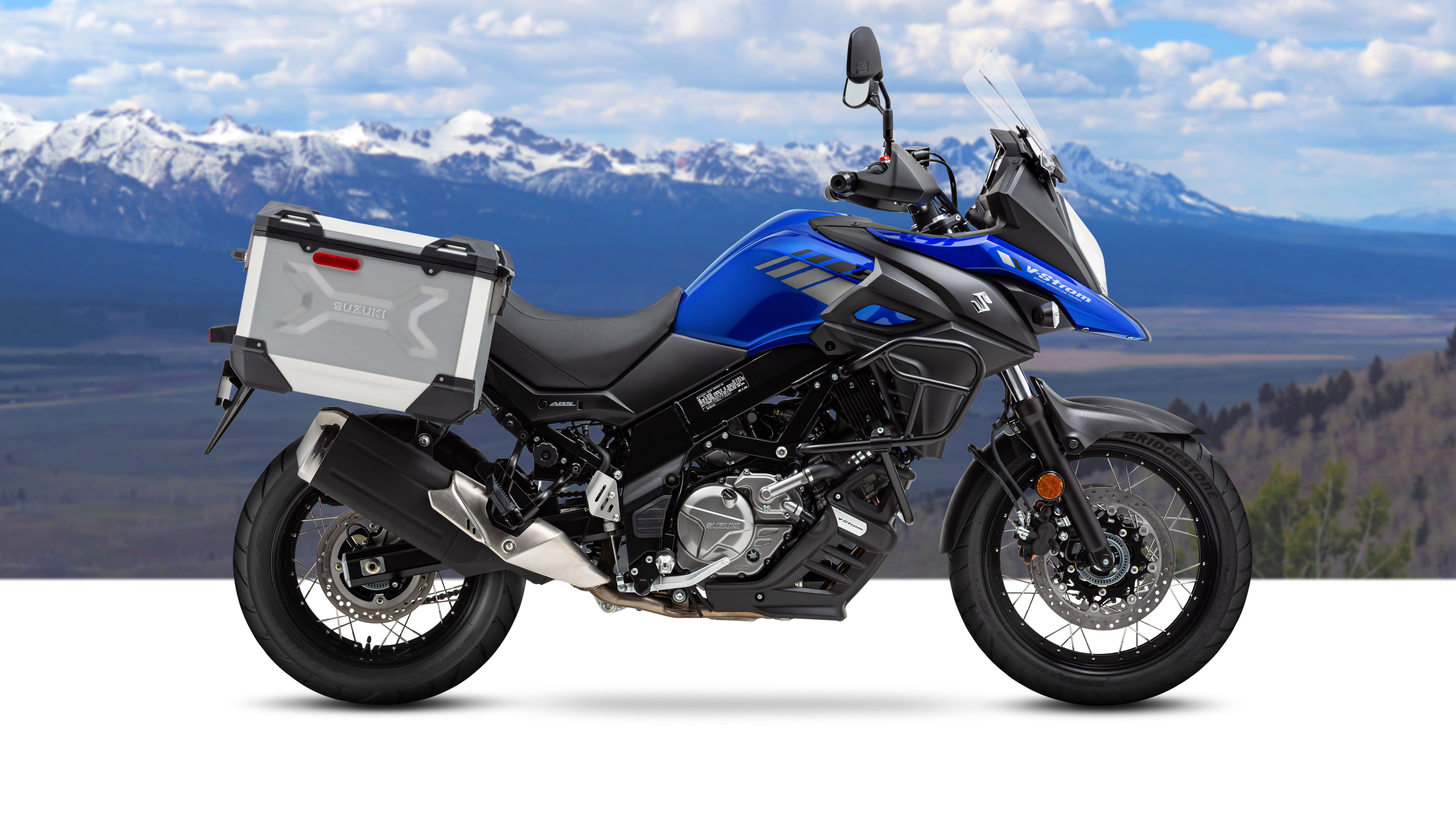 A 2020 Suzuki V-Strom 650XT Adventure with mountains in the background